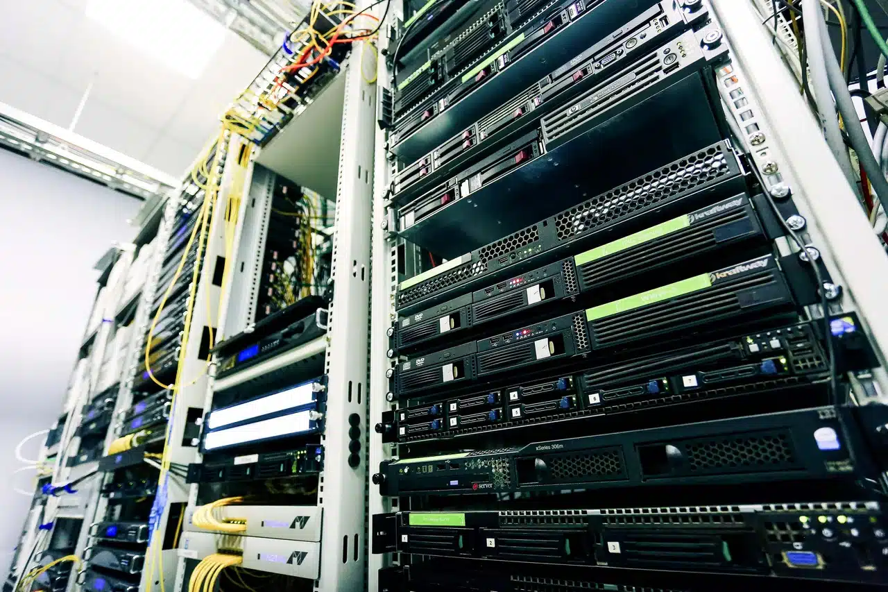 Server racks in a data center visualizing web app scalability for monolithic vs microservices architecture